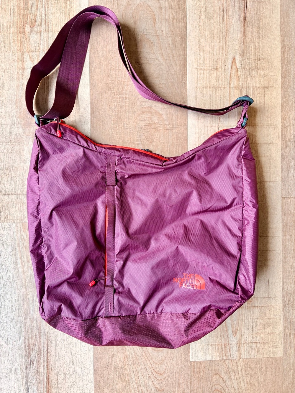 The North Face Lightweight Purple Shoulder Crossbody Bag with Orange Accents